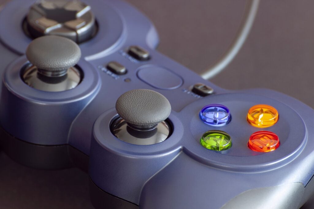 Detailed close-up of a gaming controller emphasizing its vibrant buttons.